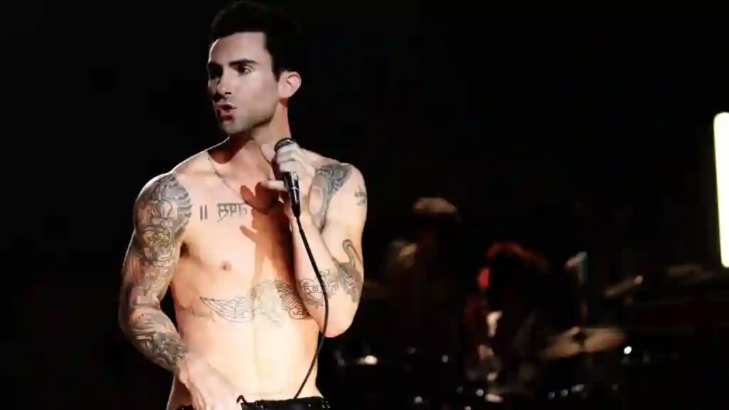 Adam Levine at red carpet event displaying self-assured body language often cited in narcissism discussions about the Maroon 5 frontman